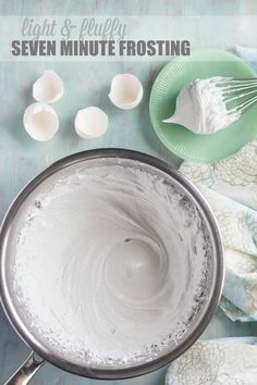 an image of white frosting in a pan with spoons and other ingredients around it