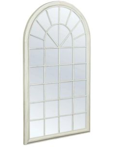 an arched window with white paint on it