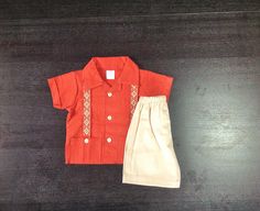 So Cute Manta Guayabera Embroidered Mexican Baby/ Toddler Shirt and Shorts Outfit Different Sizes Shirt color: Spice Orange Shorts: Beige Festive Short Sleeve Sets For Summer, Embroidered Cotton Short Sleeve Sets, Embroidered Short Sleeve Summer Sets, Summer Embroidered Short Sleeve Sets, Embroidered Cotton Sets With Short Sleeves, Casual Embroidered Short Sleeve Set, Summer Embroidered Cotton Pant Set, Cotton Pant Set With Short Sleeves, Traditional Embroidered Short Sleeve Sets