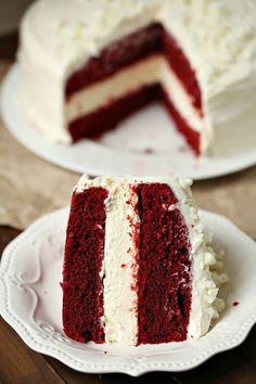 two slices of red velvet cake with white frosting