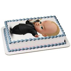 a cake with a baby in a suit on it