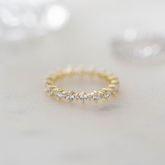 Sweet, simple, and dainty alternating CZ eternity band. Perfect for a minimalist look, or for stacking.  - - - D E T A I L S - - - * Made of 925 Sterling Silver  * We use a THICK, DURABLE 14k Gold or Rhodium plating - for a piece that will last you years to come!  * VERY HIGH QUALITY  * Available in sizes 4, 5, 6, 7, 8, 9, or 10 * Features alternating sized stones throughout the entire ring * Stone sizes: 1.5mm & 2mm * Nickel-Free & Hypoallergenic * We use the highest grade cubic zirconia stones for an authentic diamond look!  Ring Sizer- https://www.etsy.com/listing/1240904225/ring-sizer-reusable-ring-sizer-plastic?click_key=61e9f4f91cda17e59794f2a68a822a251ab4529d%3A1240904225&click_sum=ffc40ac5&ga_search_query=ring%2Bsizer&ref=shop_items_search_2&pro=1 Made with 100% Pure Love! ♡ If you Stackable Cubic Zirconia Half Eternity Rings, Minimalist Half Eternity Band In Diamond White, Minimalist Stackable Rings With Cubic Zirconia Round Cut, Minimalist Diamond White Eternity Band, Minimalist Cubic Zirconia Stackable Rings Round Cut, Minimalist Everyday Eternity Band With Round Cut, Minimalist Everyday Round Cut Eternity Band, Everyday Minimalist Round Cut Eternity Band, Minimalist Diamond White Eternity Band For Promise