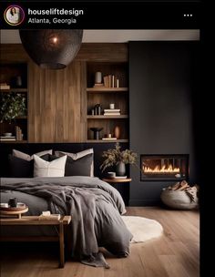 a bedroom with wood floors and black walls