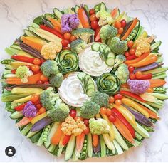 an arrangement of vegetables arranged in the shape of a circle