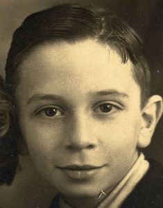 an old black and white photo of a young boy