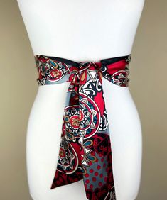 Medallion Print Sash  in Red, Black & Gray  Bohemian Sash Belt  Black & Red Print Satin Sash Belt  Boho Accessories  Satin Swank  Instantly elevate your jeans, dress, or top with this Satin Swank® reversible waist sash. Depending on your waist size and the length you choose (60, 75, and 90 inch lengths available), you can wrap this sash around your waist once or twice. You decide whether to tie the sash in a bow or a simple knot with long-hanging tails. Tie in front, in back, or on the side. A double layer of silky charmeuse satin in a red/black/gray medallion print on one side and solid black satin on the reverse side. Sash is constructed (hand cut & sewn by Satin Swank®) in one long piece. Ends are finished on the angle and seams are hidden within the fold lines. SIZING/COLOR/PRINT INFO: Red Bohemian Silk Scarf For Beach, Bohemian Red Silk Scarf For Beach, Red Bohemian Silk Scarf For Summer, Bohemian Sash, Medallion Print, Waist Sash, Satin Sash, Sash Belts, Boho Accessories