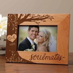 a wooden frame with the words soulmates on it and a tree in the background