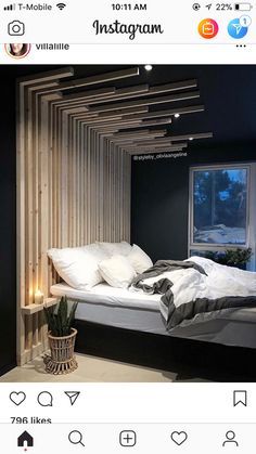 an instagram photo of a bed in a room with wooden slats on the walls