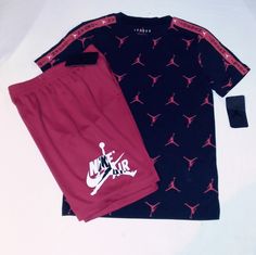 New With Tags, Jordan Set Includes A Soft Lightweight Cotton Blend Black Short Sleeve Printed Tee Top With Red Trim And Signature Jordan Jumpman Logo Print All Over With " Jordan" Inscription Wordmark Down Each Outersleeve. Bottoms Are Red With White And Black Trim Polyester Blend With Elastic Waistline With Jordan Jumpman Logo On Left Leg With "Nikeair" Inscription.. Set Fits Medium (10-12 Years) Youth Boys. Great Set For Any Occasion And Every Season. Thanks And Have A Great Day! Casual Red Sets With Graphic Print, Red Graphic Print Set For Summer, Red Graphic Print Summer Sets, Summer Red Set With Graphic Print, Casual Red Crew Neck Sets, Casual Red Sets For Streetwear, Jordan Videos, Jordan Boys, Jumpman Logo