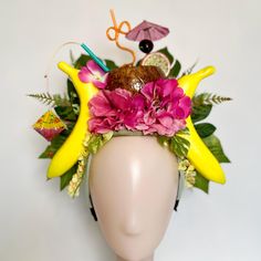 Introducing the Top Banana! Bring the island vibes to your next event with this fun and festive Tiki headpiece, featuring a playful coconut drink and vibrant lantern decorations. Perfect for festivals, beach parties, luau-themed events, and more, this unique headband is adorned with bright pink flowers, realistic bananas, and lush green leaves, making it a standout accessory for any tropical celebration. Handcrafted with attention to detail, this headpiece is not only eye-catching but also prett Summer Party Novelty Costume Hats, Fun Summer Party Costume Hats And Headpieces, Novelty Summer Party Costume Hats And Headpieces, Fun Adjustable Carnival Headpiece, Novelty Costume Hats And Headpieces For Summer Party, Novelty Summer Party Hats, Fun Summer Party Mini Hats, Fun Summer Hats For Costume Party, Summer Carnival Costume Headband