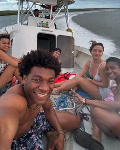 a group of people sitting on top of a boat