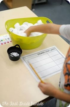 a young boy is doing something with his hands