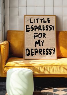 a sign that says, little espresso for my depreess on a couch