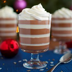 two desserts on a table with a christmas tree in the backgroung