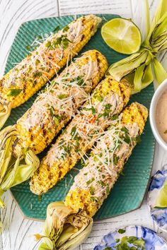 grilled corn on the cob topped with parmesan cheese and cilantro