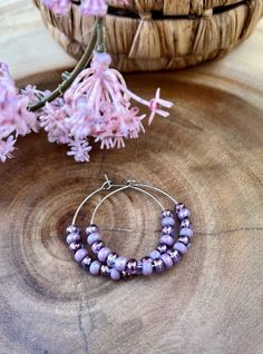 Pretty, purple amethyst colored Czech seed beads. Stainless steel hoops are lightweight and are 30mm big (1.18 inch) hypoallergenic    Keep your jewelry dry!!  Will be shipped in a organza bag for gifting or storing.  Please message with any requests or questions thank you. Bohemian Purple Earrings With Tiny Beads, Purple Hoop Earrings As Gift, Purple Hoop Jewelry For Gift, Dainty Purple Round Earrings, Adjustable Purple Hoop Earrings, Adjustable Purple Round Hoop Earrings, Adjustable Small Purple Hoop Earrings, Pink Hoop Earrings With Tiny Beads For Gift, Pink Hoop Earrings With Tiny Beads As Gift