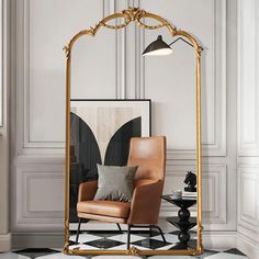 a chair sitting in front of a mirror on top of a floor next to a lamp