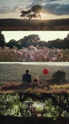 two people sitting on a hill with a red ball in the air and another person standing next to them