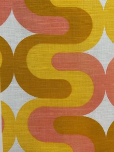 an orange and yellow pattern on fabric