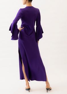 Choose the Rita Purple Dress for a showstopping look on special occasions. This timeless design is crafted from luxurious charmeuse silk, presenting a vibrant purple hue that is sure to captivate. Our pieces are majority made to order ensuring that no fabric is wasted and energy is conserved. Once the order is placed we will notify you when it has been made and is shipped out (Approximately 2-3 weeks). If you would like the dress made to your measurements: we can certainly work with you. For mor Elegant Purple Cocktail Dress, Fitted Silk Crepe Evening Dress, Silk Crepe Floor-length Formal Dress, Floor-length Silk Crepe Formal Dress, Formal Silk Crepe Floor-length Dress, Formal Floor-length Silk Crepe Dress, Luxury Floor-length Dress With Satin Finish, Chic Purple Formal Dress, Luxury Floor-length Satin Finish Dress