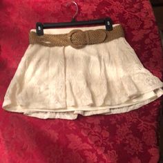 Size Small Juniors Ivory Crocheted Lace Skirt With Lining Underneath. Flowy Mini Skirt With Dark Tan Adjustable Belt. Excellent Condition Nwt Beige Flowy Lace Skirt, Beige Bottoms With Lace Trim Flowy Design, Elegant Lace Bottoms For Vacation, Summer Casual Lace Mini Skirt, Casual Lace Mini Skirt For Summer, Casual Flowy Lace Skirt, Casual Lace Flowy Skirt, Lace Skirt For Day Out, Casual Lace Skirted Bottoms