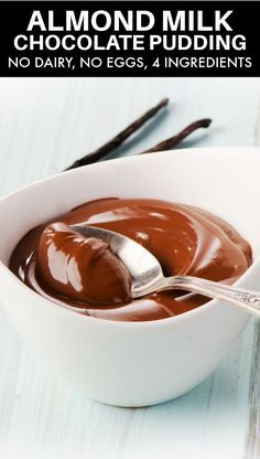 chocolate pudding in a white bowl with spoon on the side and text almond milk chocolate pudding no dairy, no eggs, 4 ingredients