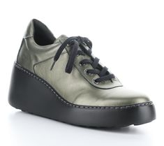 Elevate your casual look with the Fly London metallic leather fashion sneaker. Designed for ultimate comfort, this lightweight lace-up shoe features a genuine leather upper and a rounded toe shape. The super cool wedge heel adds a stylish lift to your steps. From Fly London. Fly London Shoes, London Shoes, Fly London, The Fly, Casual Look, Metallic Leather, Lace Up Shoes, Leather Fashion, Wedge Heels