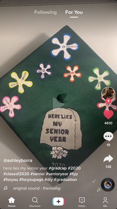 a graduation cap with the words here lies no senior year written on it and decorated with flowers