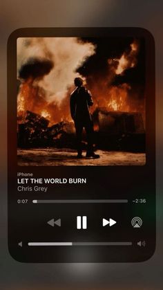 an iphone screen with the words let the world burn on it and a man standing in front of a fire