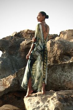 Freya Ashtanga Kaftan, this beautiful v-neck printed caftan in pure silk is cut oversized for an elegant drape and voluminous movement. Featuring a deep v-neckline and adjustable tie at the back. This dress can be transformed from day to night. Wear it as evening wear or as part of your beach outfit. 100% Silk Dry clean Handmade in Ireland FREYA PRINT: A dragonfly inspired print with shiny, iridescent, delicate and intricate wings in an ombre palette of metallics, antique gold, copper, bronze, c Silk V-neck Dress For Vacation, Chic Silk V-neck Kaftan, Chic Silk Kaftan For Beach Cover-up, Silk Flowy V-neck Maxi Dress, Elegant Maxi Dress With Kimono Sleeves For Festival, Silk V-neck Kaftan For Beachwear, Silk Wrap Dress For The Beach, Silk V-neck Beachwear Dress, Bohemian V-neck Silk Dress