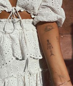 a woman with a tattoo on her arm