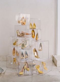 a bunch of shoes that are on display in a glass case, with the caption'this makes me laugh and i feel fabulous at the time x '