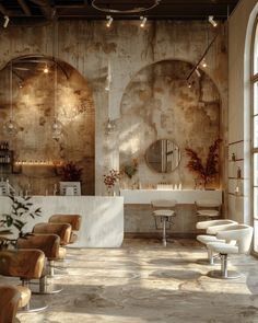 the interior of a salon with chairs, mirrors and lights on the wall behind them