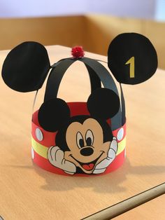 a paper mickey mouse hat sitting on top of a table