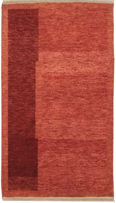 a red rug with two squares on the bottom and one rectangleed in brown