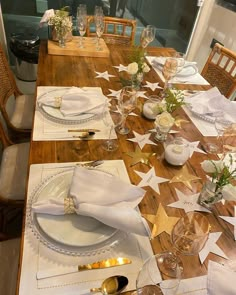 the table is set with place settings and napkins for guests to sit down at