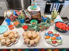 a table filled with lots of food and snacks