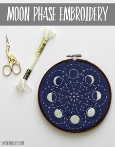 the moon phase embroidery kit is ready to be sewn on with scissors and thread