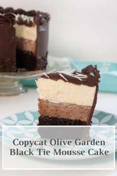 a piece of cake on a plate with the words copycat olive garden black tie mouse cake