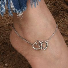 We Are In Love With This Adorable Antiqued Finished Anklet. Featuring Two Interlocked Hearts Nestled In The Center Of An Adjustable Silver Chain, This Anklet Will Be A Favorite. Anklet Measures 8.66" With A 1.6" Extender To Adjust Size. Trendy Adjustable Heart-shaped Anklets, Heart-shaped Anklets For Valentine's Day, Trendy Heart Shaped Anklets For Gift, Trendy Adjustable Heart Anklets, Trendy Heart-shaped Anklets For Gifts, Casual Heart Charm Bracelet, Trendy Heart-shaped Anklets For Valentine's Day, Trendy Valentine's Day Gift Anklets, Trendy Anklets For Valentine's Day