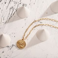 The complement for Lotus is countless, ancient and modern, Chinese and foreign. With this gorgeous engraved Lotus on the coin and a stylish chain, the floral pendant necklace will be a fresh take to your outfit for its unique design dipped in 18k gold. The size of this July birth flower makes it ideal pendent to wear every single day. Upgrade your look and decorate your bare neck. The gorgeous engraved Lotus as July birth flower Ideal size of the necklace Upgrade your look and decorate your bare Yellow Gold Coin Chain Necklace As Gift, Yellow Gold Coin Chain Necklace Gift, Round Gold-tone Coin Necklace As Gift, Gold-tone Round Coin Necklace Gift, Gold Flower Pendant Choker Necklace, Gold Necklace With Flower Charm Round Pendant, Gold Chain Necklace With Flower Pendant, Yellow Gold Metal Pendant Coin Necklace, Yellow Gold Metal Coin Pendant Necklace