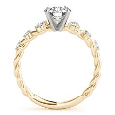 a yellow gold engagement ring with diamonds on it