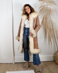 "Discover Boho Elegance: Shop Our Vintage Brown Shearling Fur Coat Today!" Enhance your winter wardrobe with the timeless charm of our Northern Sheeprs LLC Women Penny Lane Long Boho Shearling Fur Coat. This 70's Vintage-inspired brown trench coat combines Y2K Boho and Hippie aesthetics, offering a warm and stylish solution for the colder months. Crafted with care and attention to detail, our wool coat boasts both fashion and function. Elevate your winter fashion game with this exquisite piece, Hippie Winter Outfits, Shearling Coat Womens, Boho Street Style, Afghan Coat, Boho Coat, Brown Trench Coat, Penny Lane Coat, Retro Coat