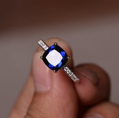 This is a gorgeous handmade creation. Its beauty is its simplicity & Elegance. The 8*8mm cushion shape faceted lab sapphire is crafted in solid sterling silver and with rhodium plated. All item is sent in a beautiful gift box You can realize more lovely stuff clicking the link https://www.etsy.com/shop/knightjewelry?refshopsection_shophome_leftnav Please leave the correct address and you phone number for delivering successfully. Blue Gemstone Ring, September Birthstone Rings, Ruby Rings, Blue Gemstone Rings, Birthstone Rings, Blue Sapphire Diamond, Ruby Earrings, September Birthstone, Blue Sapphire Rings