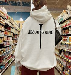 Jesus Is King Shirt, Trendy Christian Sweatshirt, Women's Religious Shirt, Bible Verse Tshirt, Christian Gifts For Her, Catholic Gifts, ⚜️Welcome to CustomTeeCHIQ ⚜️ "We want to know, design and print what you imagine. " - We design, print and press our products. - Our design will be made with Direct to Film technology. - If you want to add or change anything to the existing design that we show in the screenshot, please contact us. - If you enter the wrong address with your order, we will try to help you only if the item was not made and processed up to the packaging level to ship the item, message us from the message box. ⚜️HOW TO ORDER CUSTOM DESIGN⚜️ * Select a style "T-shirt, Sweatshirt, Hooded Sweatshirt or Toddler" * Choose your size. * Choose your primary color. * If your item has a Jesus Is King Shirt, Music And The Brain, Christian Clothing Brand, Jesus Clothes, Christian Hats, King Shirt, Christian Shirts Designs, Christian Hoodies, Christian Fashion