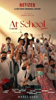 a group of people with masks on posing for a photo in front of a movie poster