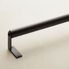 The name says it all. This is the perfect everyday curtain rod. Versatile classic modern design pairs with any room or existing decor. Made from 100% stainless steel, it also stands the test of time. CB2 exclusive.     Designed by Mermelada Estudio  Stainless steel  Set includes 1 rod, 2 end brackets and mounting hardware  Clean with a soft cloth  Imported Essential Black Curtain Rod 28"–48"x1.25" White Oval Dining Table, Black Curtain Rod, Brass Curtain Rod, Modern Curtain Rods, Classic Modern Design, Ivory Chair, Black Curtain Rods, Linen Blackout Curtains, Curtain Rings With Clips