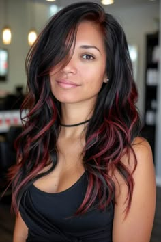 Craving a bold hair transformation? Red highlights on black hair are the perfect way to add fire and dimension to your style. This striking combination turns heads, exudes confidence, and brings out your inner diva. Black Hair With Red Pieces, Long Hair Red Highlights, Bayalage Brunette Red Balayage, Bright Red Balayage Hair Brunettes, Merlot Highlights On Dark Hair, Dark Brown Hair With Red Highlights Long, Black Cherry Hair Color With Highlights, Dark Hair Pink Highlights, Deep Red Balayage Hair