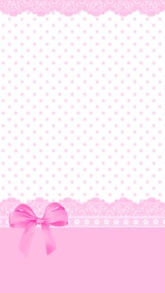 a pink ribbon and bow on a white background with polka dotty border stock photo