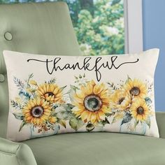 a pillow with sunflowers on it that says, thank